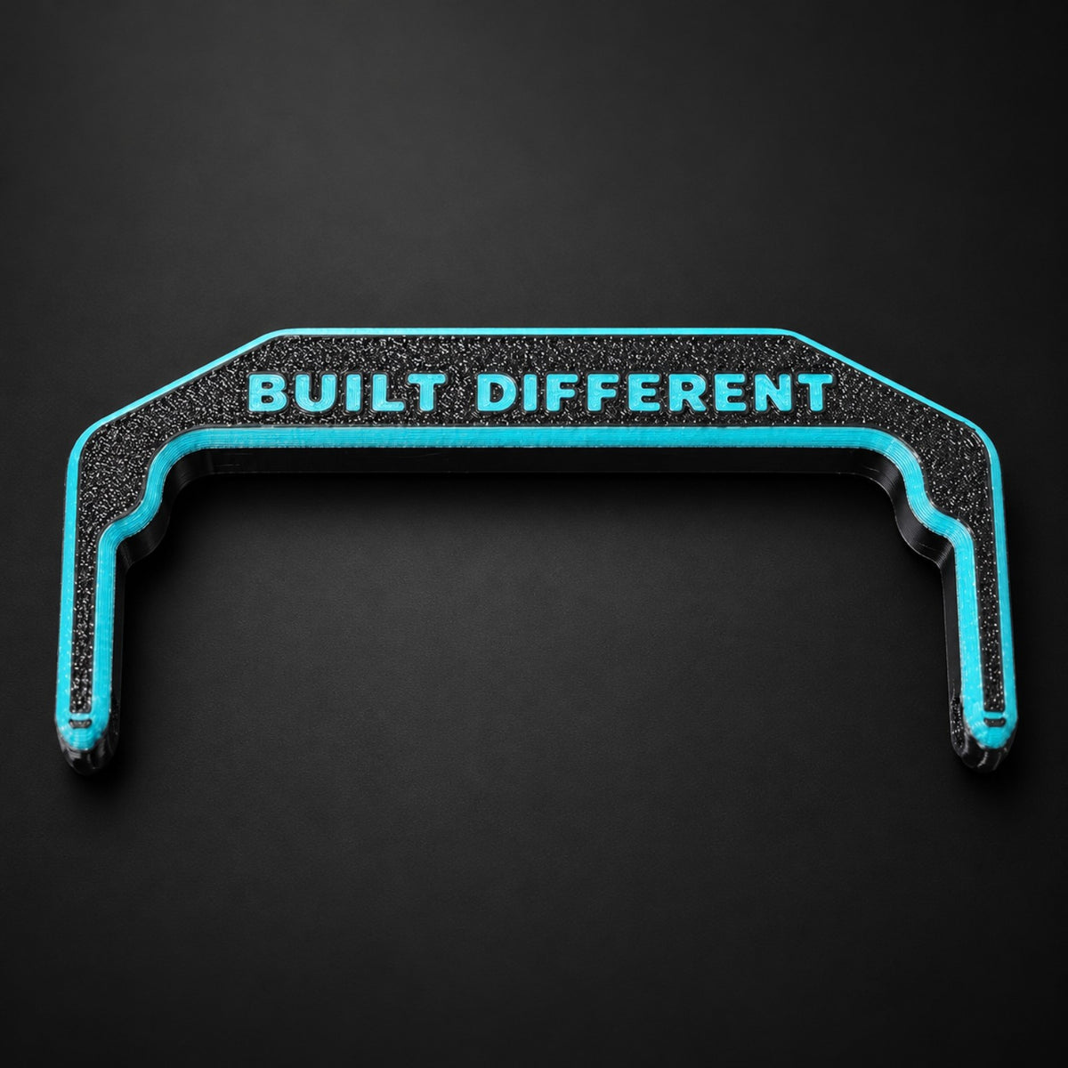 Apache 1800 Built Different handle in black with turquoise accents.